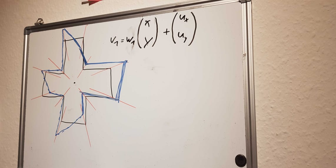 A whiteboard with calculations